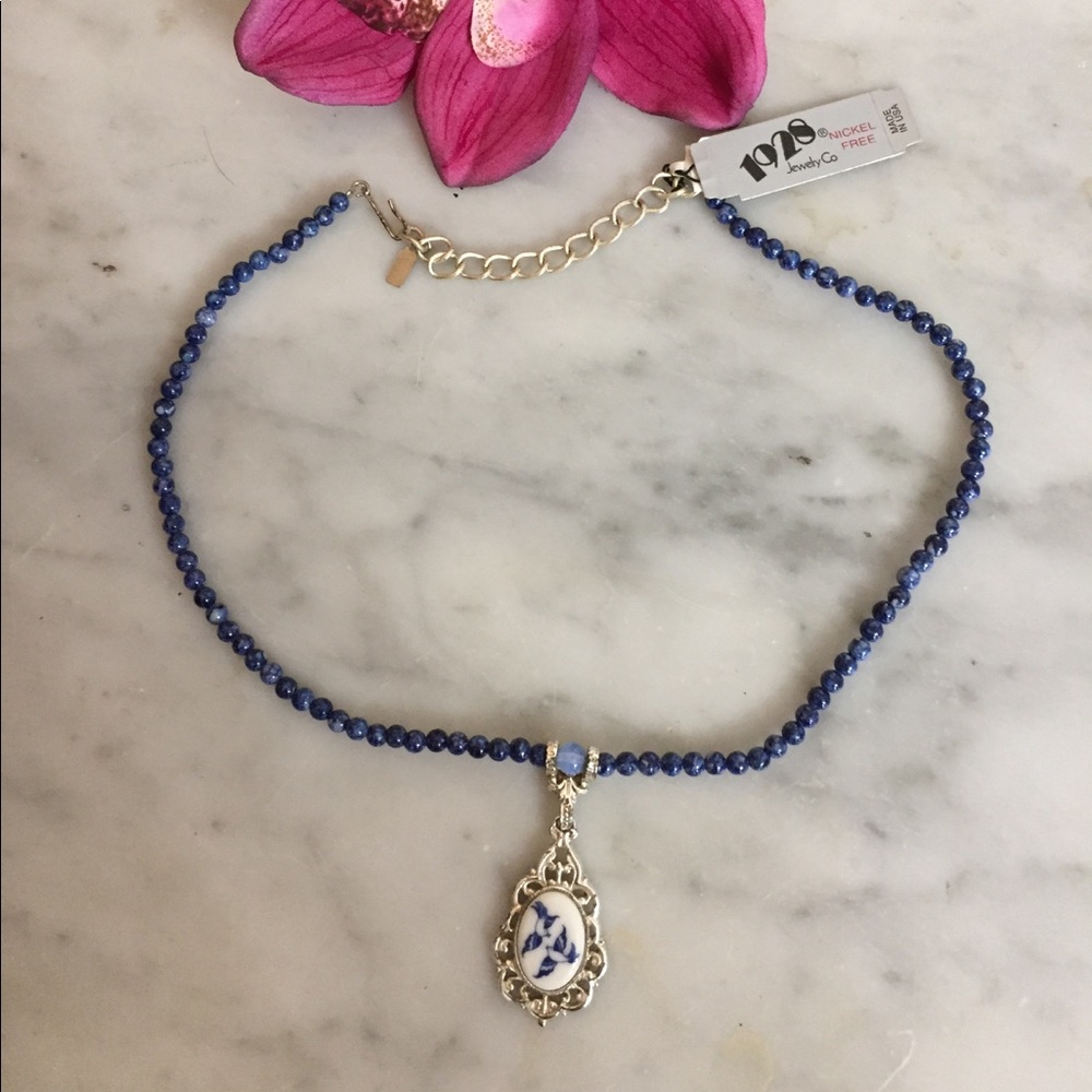 New 1928 Blue Necklace with bird pendant.
